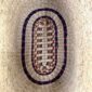 Inside base of the natural oval Bolga basket, showing the dark coiled ring