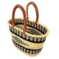 Angled view of the oval Bolga basket with black bands and a central black diamond motif, showing the woven interior