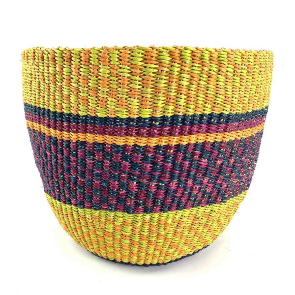 planter-basket-089-bloom-bright-warm-banded-vegan-bolga-bashiri-3 Front view of the warm-toned banded planter basket, handwoven from elephant grass