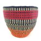 Front view of the high-contrast striped planter basket, handwoven from elephant grass