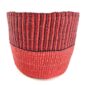 Front view of the two-tone ribbed planter basket, handwoven from elephant grass