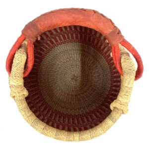 Top view inside the Bolga pot basket with an orange-red and natural stepped pattern and a leather-wrapped handle