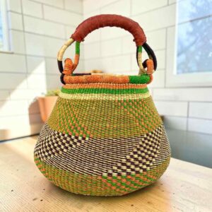 Bolga pot basket with olive green with a black and natural check, an orange rim and a leather-wrapped handle