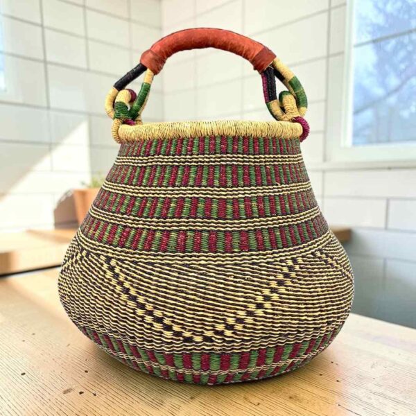 Bolga pot basket with fine maroon, black and natural stripes and a leather-wrapped handle