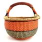 Front view of the orange and black xl round bolga basket on a white background
