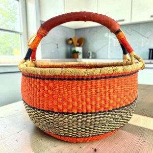 XL round Bolga basket in orange and black, handwoven from elephant grass