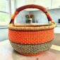 XL round Bolga basket in orange and black, handwoven from elephant grass