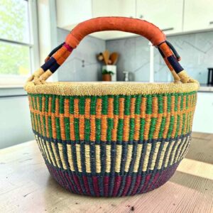 XL round Bolga basket in orange and navy, handwoven from elephant grass