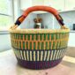 XL round Bolga basket in orange and navy, handwoven from elephant grass