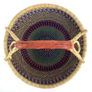 Top-down view inside the purple and teal xl round bolga basket, showing the coiled base