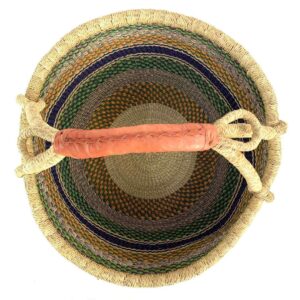 Top-down view inside the green and mustard xl round bolga basket, showing the coiled base