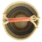Top-down view inside the green and mustard xl round bolga basket, showing the coiled base