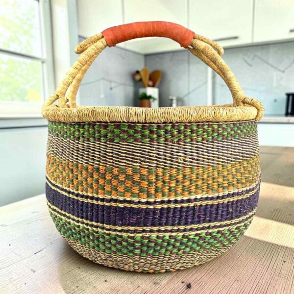 XL round Bolga basket in green and mustard, handwoven from elephant grass