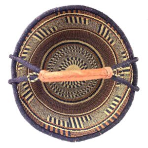 Top-down view inside the brown and navy xxl round bolga basket, showing the coiled base
