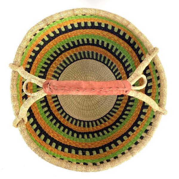 round-basket-xl-568-wyde-lime-orange-bolga-african-basket-bashiri-2 Top-down view inside the lime and orange xxl round bolga basket, showing the coiled base