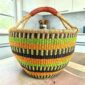XXL round Bolga basket in lime and orange, handwoven from elephant grass