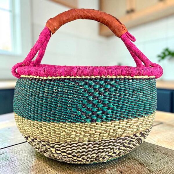 Large round Bolga basket with a bright contrasting rim, leather handles