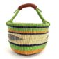 Front view of the large round Bolga basket with bright leafy and citrus bands and deep inky stripes, on a white background