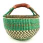 Front view of the large round Bolga basket with a fresh leafy band over a warm earthy checkerboard, on a white background