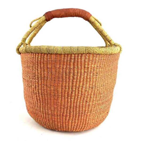 round-large-basket-858-harmony-orange-bolga-woven-bashiri-3 Front view of the large round Bolga basket with a single warm terracotta tone and natural rim, on a white background