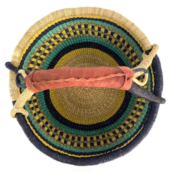 round-large-basket-861-serenity-navy-yellow-teal-bolga-woven-bashiri-2 Top-down view inside the large round Bolga basket with bold sunny, sea-green and deep inky bands, showing the coiled base and leather handle