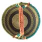 Top-down view inside the large round Bolga basket with muted olive and slate tones with natural checks, showing the coiled base and leather handle