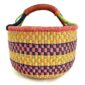 Front view of the large round Bolga basket with bright citrus and rosy bands with deep inky checks, on a white background