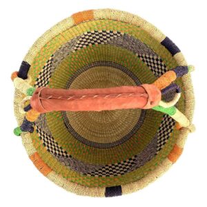 Top-down view inside the large round Bolga basket with zesty citrus tones and a diagonal inky checked section, showing the coiled base and leather handle