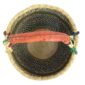 Top-down view inside the large round Bolga basket with fine dark checks and rust and leafy stripes, showing the coiled base and leather handle
