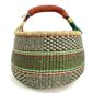 Front view of the large round Bolga basket with fine dark checks and rust and leafy stripes, on a white background