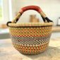 Large round Ghana basket traditionally woven from sustainable elephant grass. Durable, spacious and individually handmade in Northern Ghana.