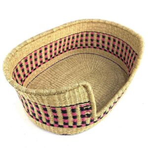 Angled view of the small pink and black checked pet basket showing the woven base