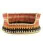 Front view of the small coral, black and yellow Bolga pet basket with its dipped front