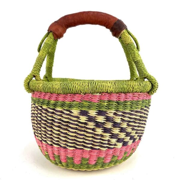 small-round-african-basket-704-kojo-bashiri-2 Front view of the small round Bolga basket with a chequered body and bright handle wraps