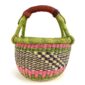 Front view of the small round Bolga basket with a chequered body and bright handle wraps