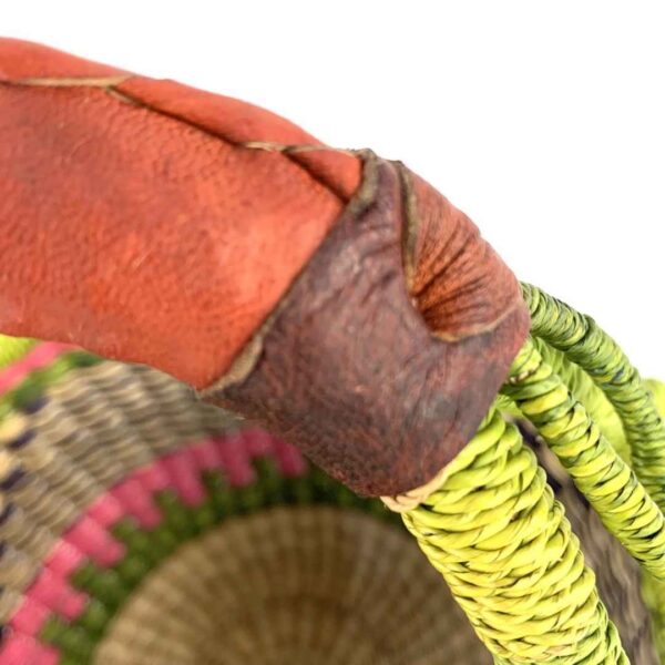 small-round-african-basket-704-kojo-bashiri-4 Close-up of the stain on the leather handle wrap of the small round Bolga basket