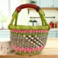 Small round Bolga basket with a chequered body and bright handle wraps and leather-wrapped handle