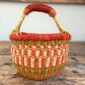 Handcrafted small round Bolga basket woven by Ghanaian artisans