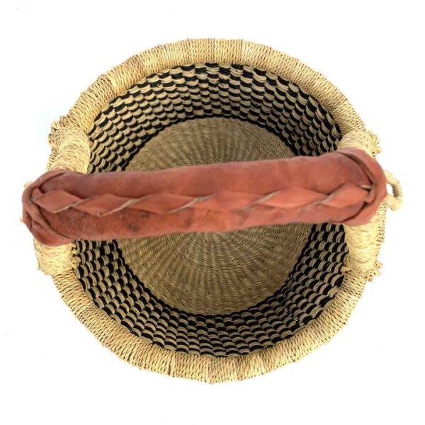 small-round-basket-716-angular-black-natural-bolga-african-basket-bashiri-2 Top-down view inside the small round Bolga basket with a black and natural checked weave, showing the coiled base