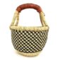 Front view of the small round Bolga basket with a black and natural checked weave, on a white background