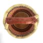 Top-down view inside the small round Bolga basket with orange, red and navy stacked bands, showing the coiled base