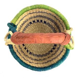 small-round-basket-719-tweed-teal-green-bolga-handwoven-bashiri-2 Top-down view inside the small round Bolga basket with navy stripes on natural straw with a teal and green rim, showing the coiled base