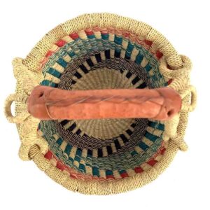 small-round-basket-722-earthly-teal-red-bolga-woven-bashiri-2 Top-down view inside the small round Bolga basket with teal, red and dark stepped bands, showing the coiled base