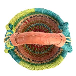 small-round-basket-723-glossy-green-coral-bolga-african-basket-bashiri-2 Top-down view inside the small round Bolga basket with green rim and coral, orange and dark bands, showing the coiled base