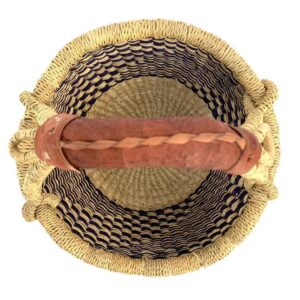 small-round-basket-724-cactus-navy-natural-woven-bolga-bashiri-2 Top-down view inside the small round Bolga basket with a navy and natural staggered check, showing the coiled base