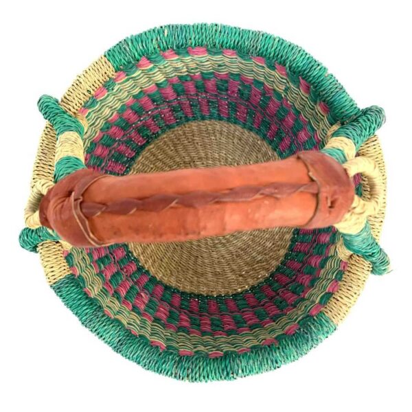 small-round-basket-725-evolution-teal-pink-bolga-handwoven-bashiri-2 Top-down view inside the small round Bolga basket with teal and pink checked bands with a teal rim, showing the coiled base