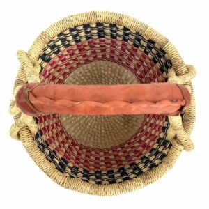 small-round-basket-726-solution-navy-red-bolga-woven-bashiri-2 Top-down view inside the small round Bolga basket with navy checks over red and pink bands, showing the coiled base