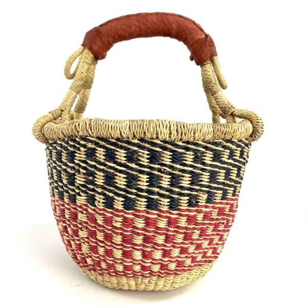 small-round-basket-726-solution-navy-red-bolga-woven-bashiri-3 Front view of the small round Bolga basket with navy checks over red and pink bands, on a white background