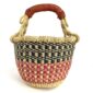 Front view of the small round Bolga basket with navy checks over red and pink bands, on a white background