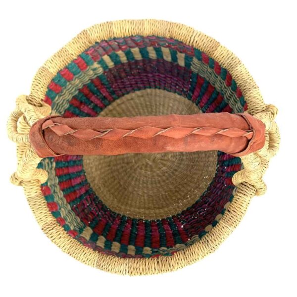 small-round-basket-728-mineral-teal-red-stripe-woven-bolga-bashiri-2 Top-down view inside the small round Bolga basket with teal, red and natural upright stripes, showing the coiled base